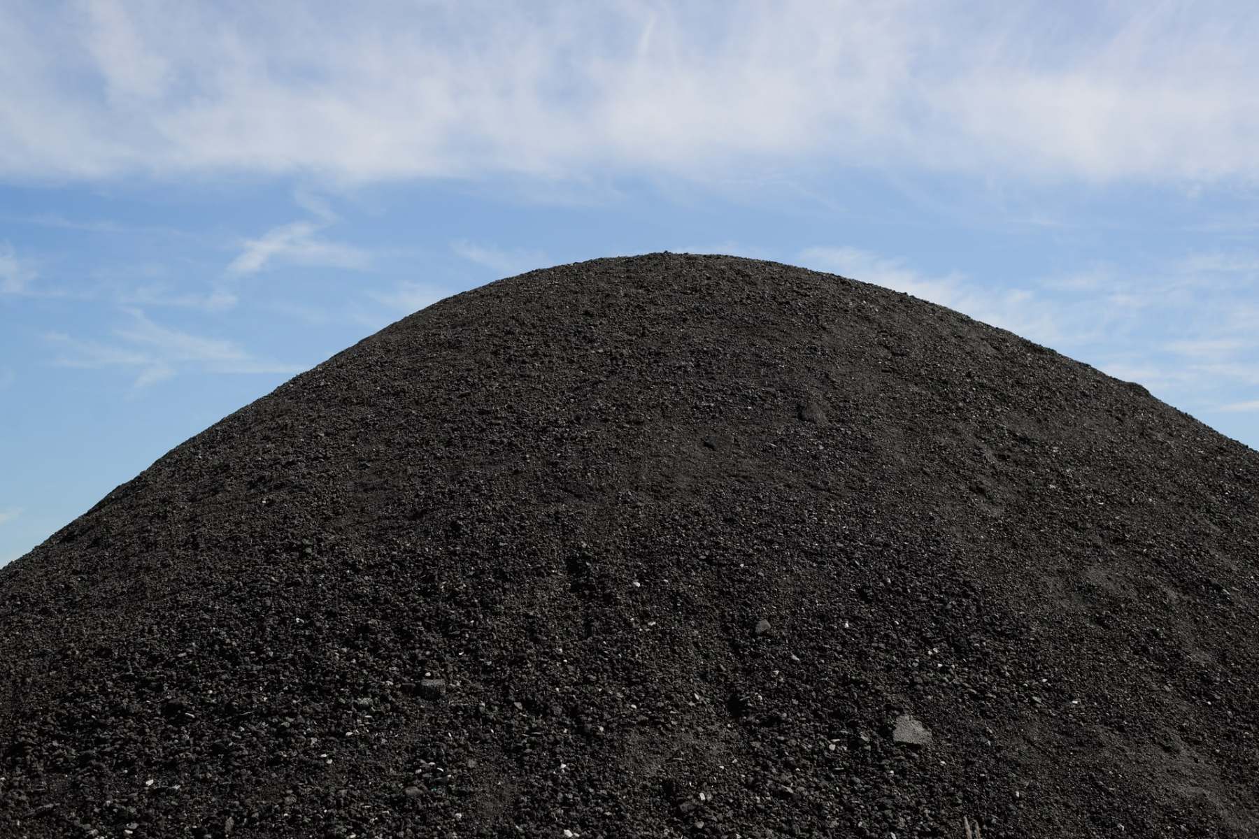 big-pile-of-black-coal-against-blue-sky-outdoors-2023-11-27-05-36-12-utc-min